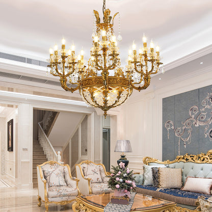JEWELLERY TOP brand's luxury crystal chandelier showcasing elaborate scrolling brass arms and tiered crystal drops.