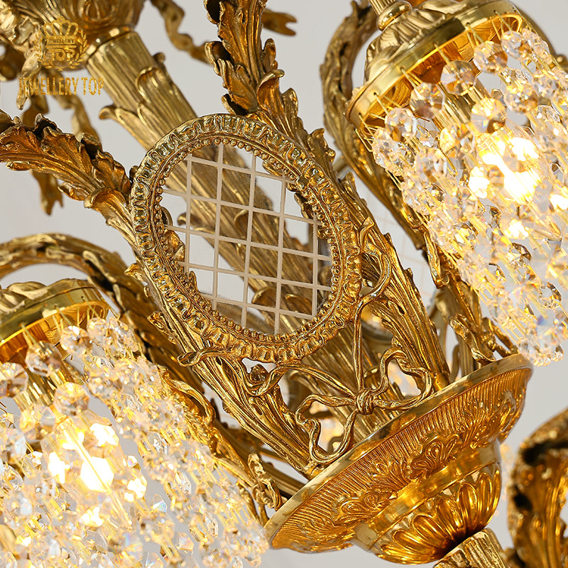 Macro close-up of the finely detailed acanthus leaf carvings and the robust solid brass construction.