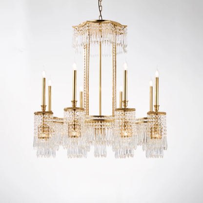 Multi-tiered European brass chandelier with crystal fringe, suspended by chains, black background.