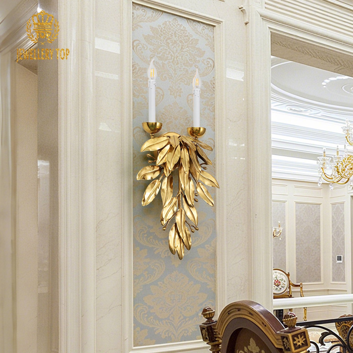 The vintage luxury brass wall lamp installed on a decorative blue and gold damask wallpaper, brand logo visible.
