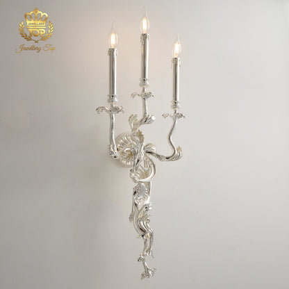 Front view of The Chloris Rococo 3-light wall sconce featuring a luxury silver chrome finish by Jewellery Top.