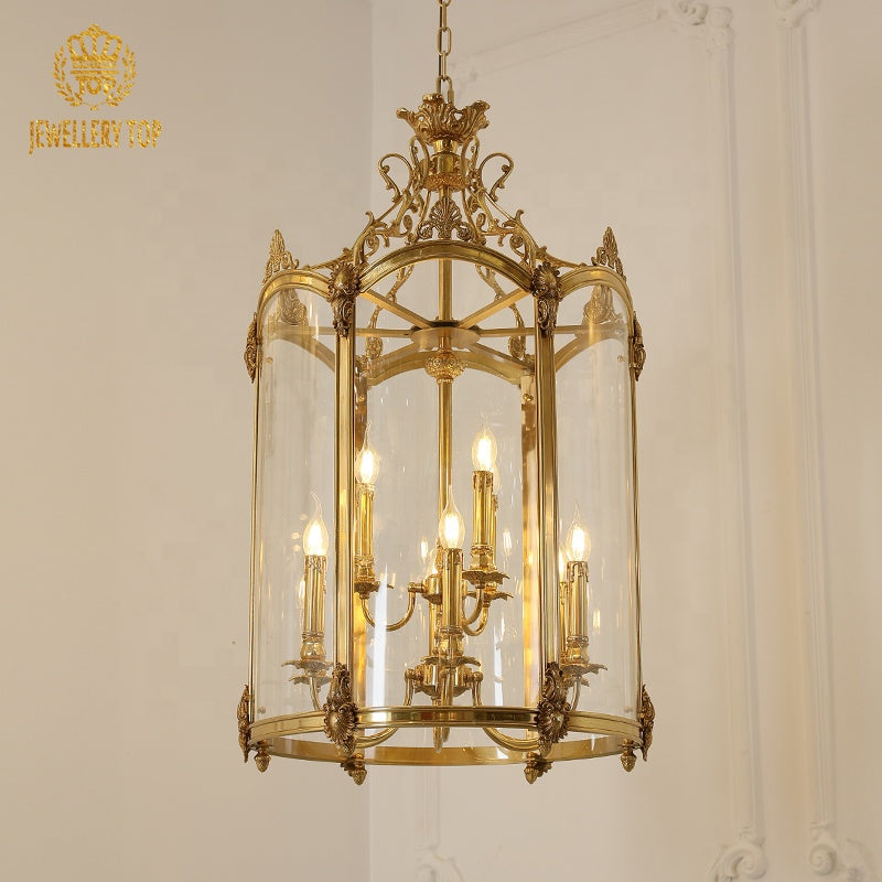French lantern brass pendant light installed on a classic white wall with molding, JEWELLERY TOP.