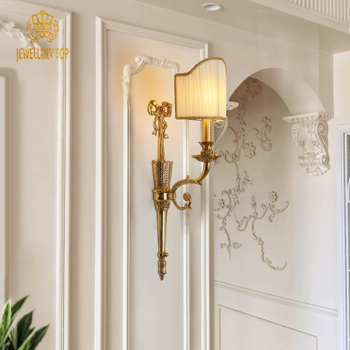 The home decor wall light mounted on a white textured wall with intricate molding, emitting a soft, warm glow.