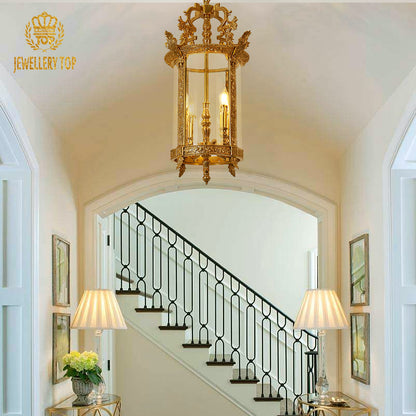 JEWELLERY TOP french brass pendant light installed in a stairwell with artwork and wainscoting.