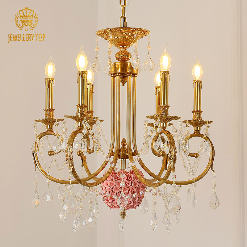 Extreme detail shot focusing on the candle-shaped filament bulbs and the decorative brass canopy at the top.