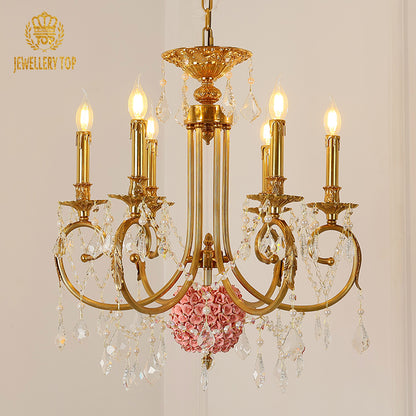 Extreme detail shot focusing on the candle-shaped filament bulbs and the decorative brass canopy at the top.
