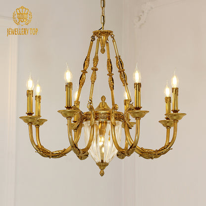 Macro close-up of the finely detailed golden acanthus leaf embellishments and the precision-cut crystal pendants.