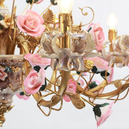 Extreme detail shot of hand-painted ceramic roses and brass leaves on a decorative chandelier.