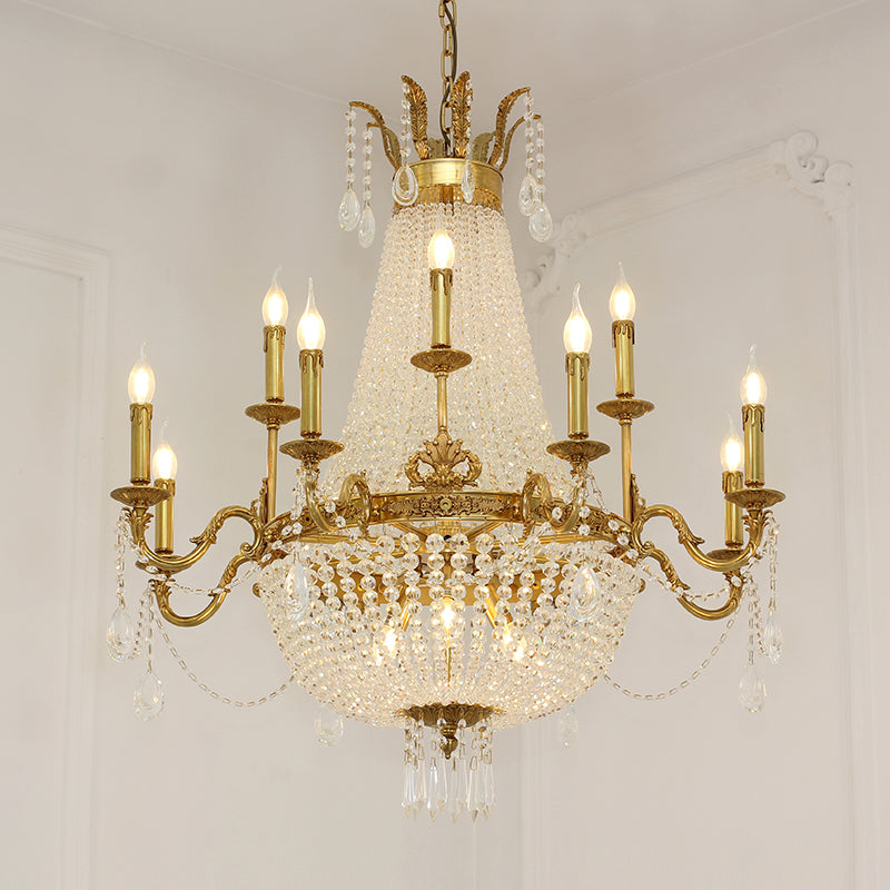 Classic Rococo-style brass chandelier with intricate metalwork and clear crystal drops.