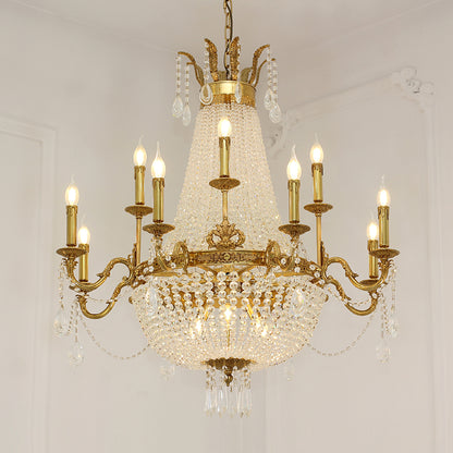Classic Rococo-style brass chandelier with intricate metalwork and clear crystal drops.
