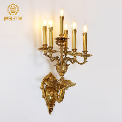 JEWELLERY TOP branded shot of the all-copper wall sconce light, showcasing its intricate details and warm bulb glow.
