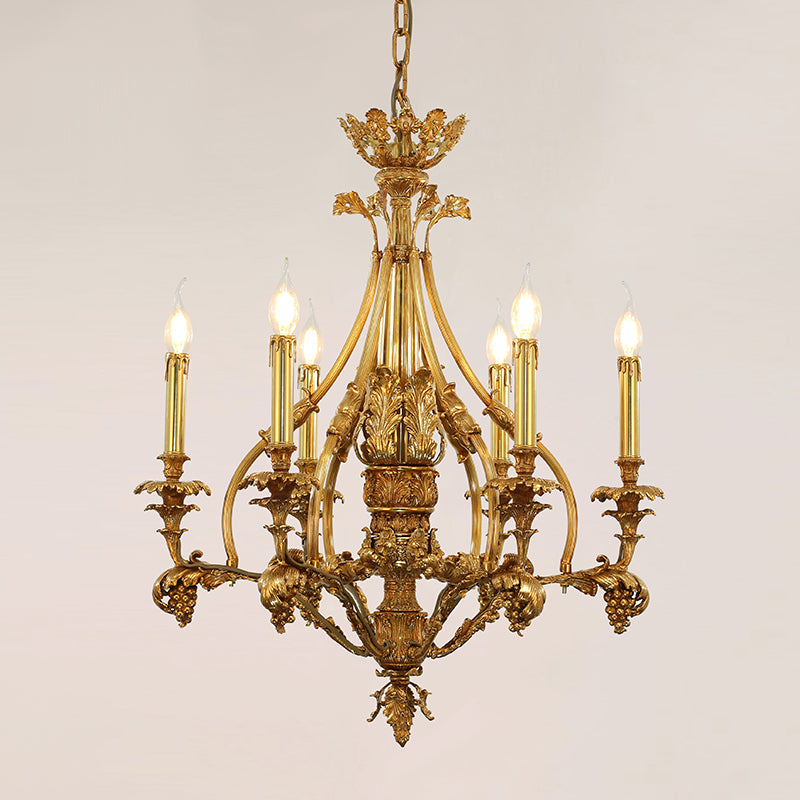 Luxurious brass chandelier with grapevine and leaf carvings, showcasing golden Baroque craftsmanship.
