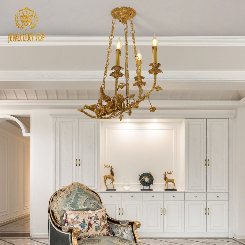 JEWELLERY TOP brand's antique chandelier featuring a detailed golden cherub sculpture and leafy tendrils.