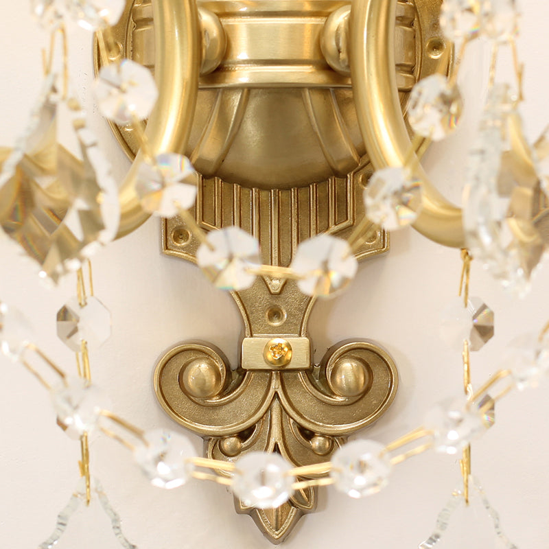 Detailed shot focusing on the intricate brass carvings and the sparkling crystal droplets of the home decor lamp.