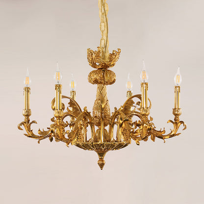 Macro close-up of the finely sculpted golden acanthus leaves and the ornate candle drip tips.