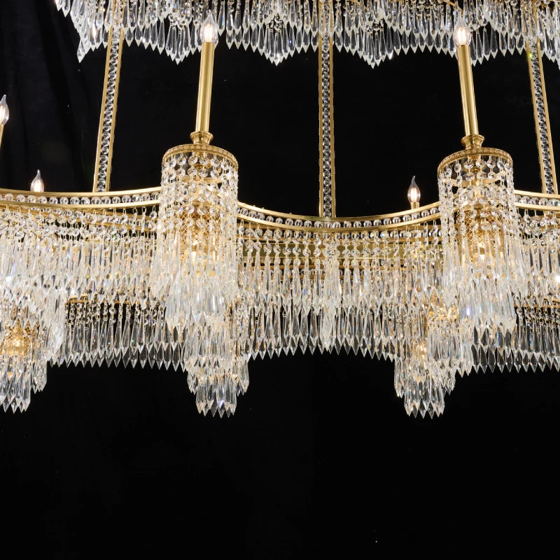 Close-up of a French crystal brass chandelier showcasing teardrop crystals and candle-style lights.