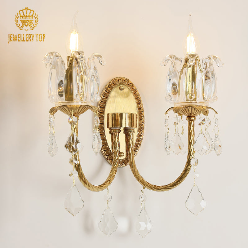Close-up product shot of the ornate French-style sconce, highlighting its elegant tulip-shaped glass shades and warm glow.