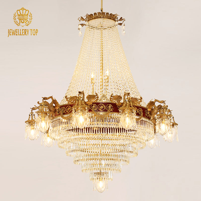 JEWELLERY TOP branded golden brass chandelier with bird sculptures and crystal cascade.