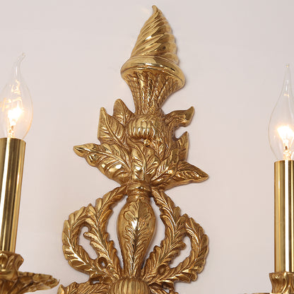 Detailed shot focusing on the sconce’s ornate arm with deep leaf carvings and a finely crafted bulb holder.