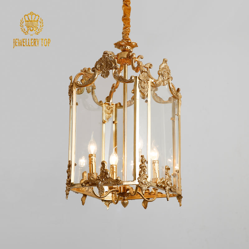 Front view of JEWELLERY TOP’s brass lantern pendant light with clear glass panels.