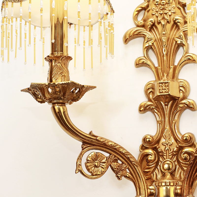 Detailed shot of a single ivory fabric lampshade with lace edging and the sparkling crystal bead fringe.