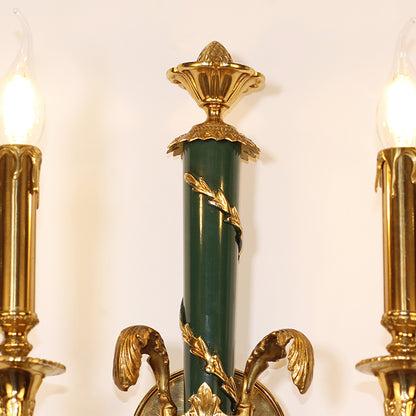 Side profile of the wall lamp highlighting the curved brass arm, spiral texture, and classic candle bulb.