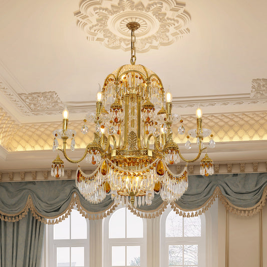 A french luxury chandelier installed in an elegant living room with classic French wall molding and a grand fireplace.