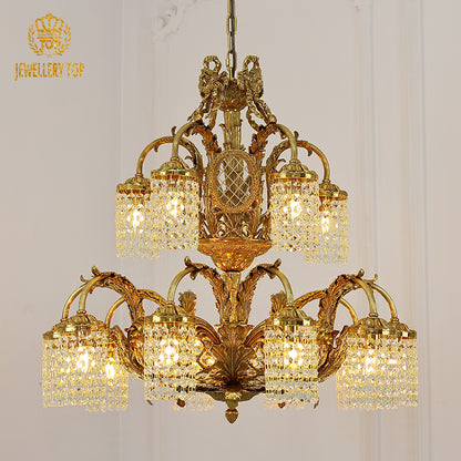 A luxurious interior view featuring the large eagle-motif brass chandelier illuminating a grand space with ornate ceiling moldings.