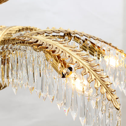 Warm glow from the candle bulbs within the palm leaf structure of the luxury chandelier.