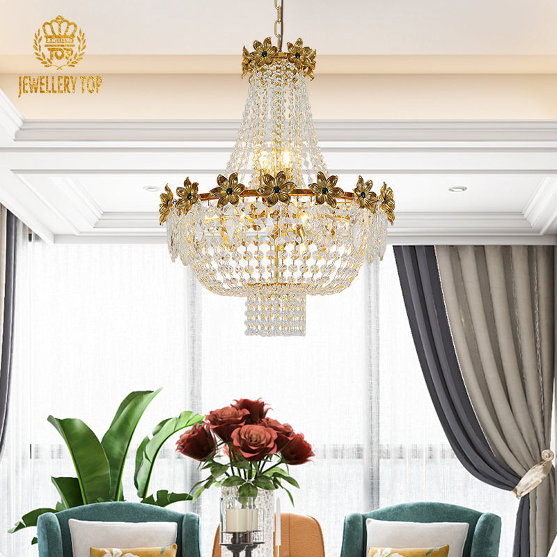 A villa living room chandelier installed in a grand residence with ornate ceiling details and sophisticated furnishings.