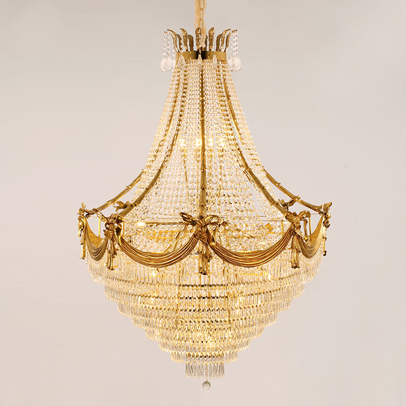 JEWELLERY TOP brand's crystal staircase chandelier featuring a central Psyche sculpture and golden accents.