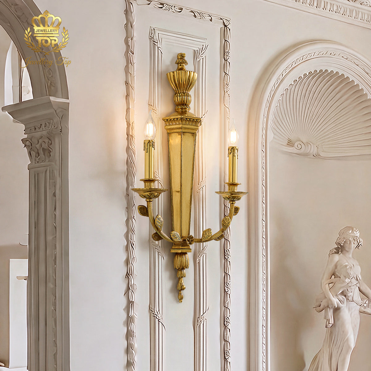 The George III Girandole brass sconce installed on a classic carved plaster wall panel by Jewellery Top.