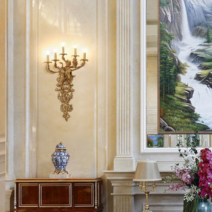 The luxurious brass wall lamp installed in an elegant interior with a Chinese vase, landscape painting, and fresh flowers.