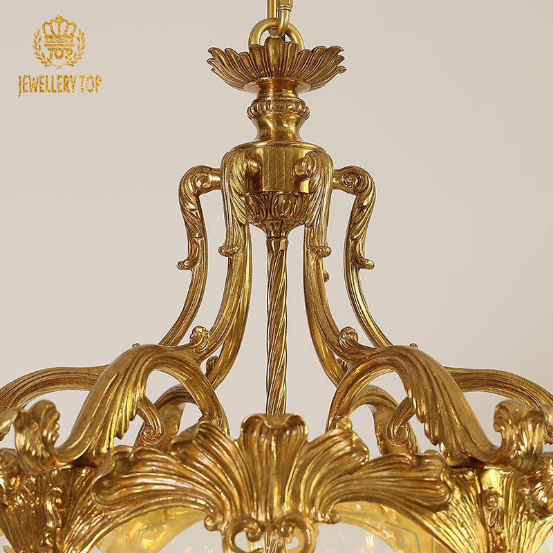 Detailed top view of a JEWELLERY TOP brass pendant light’s canopy and ornate central column.