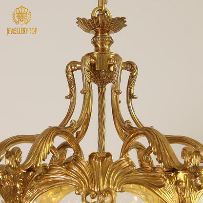 Detailed top view of a JEWELLERY TOP brass pendant light’s canopy and ornate central column.