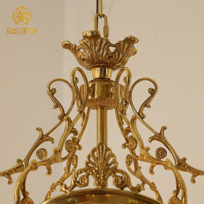 Extreme close-up of ornate brass canopy and floral on the luxury pendant light, JEWELLERY TOP.