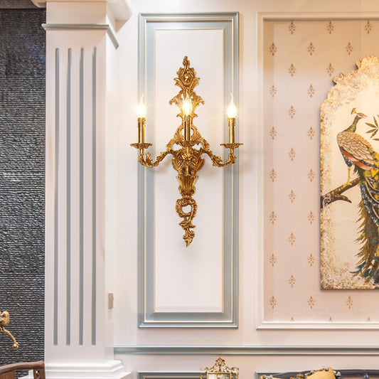 The French antique wall sconce installed in a white framed niche beside a decorative painting with a peacock.