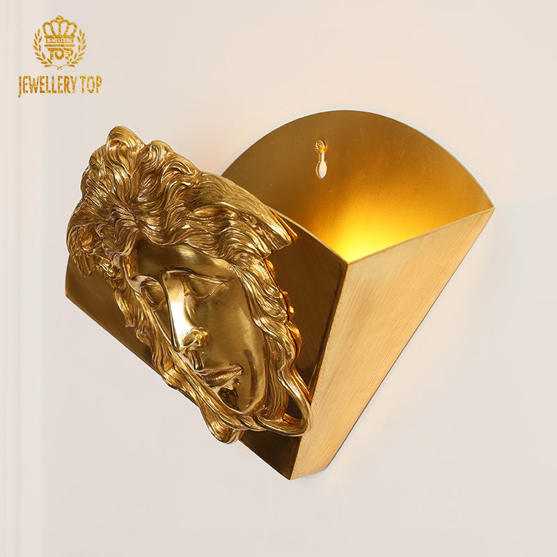 Art decorative brass wall lamp with a majestic lion head sculpture, showcasing detailed mane texture.