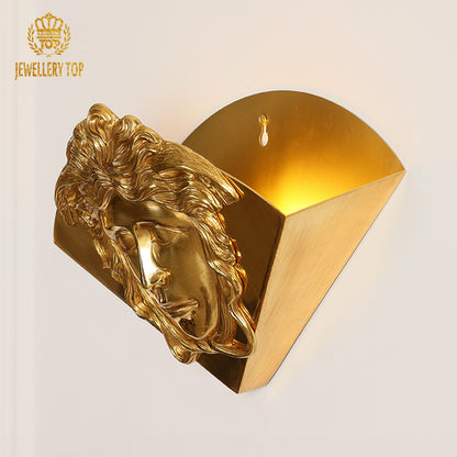 Art decorative brass wall lamp with a majestic lion head sculpture, showcasing detailed mane texture.