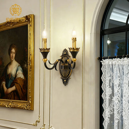 Classic interior scene with the golden indoor decorative wall lamp, a portrait in a gilded frame, and lace curtains.