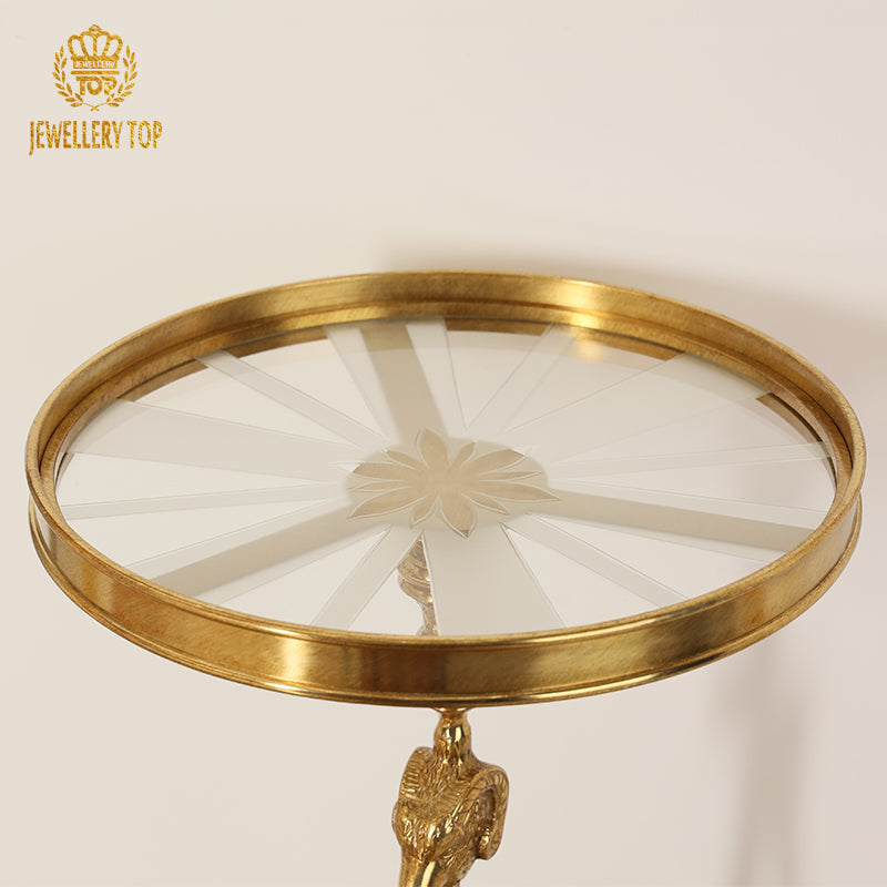 Top-down close-up view of the etched sunburst glass tray top on the brass side table by Jewellery Top.