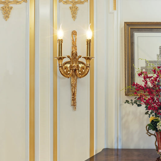 Close-up detail of the central brass column showcasing intricate engraved textures and classic antique finish.