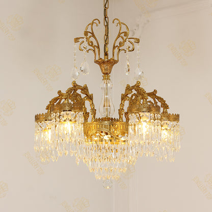 Classic brass chandelier with a central crystal column and side cascades, elegant design.