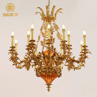 JEWELLERY TOP brand's golden brass Baroque chandelier with a distinctive orange glass centerpiece.