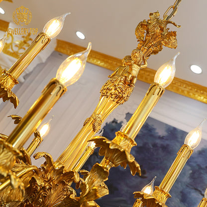 Low-angle view of a multi-arm brass chandelier with angel sculptures and gold trim.