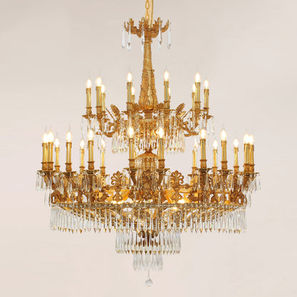Detailed view of the hand-chased acanthus leaf motifs on a luxury brass chandelier frame.