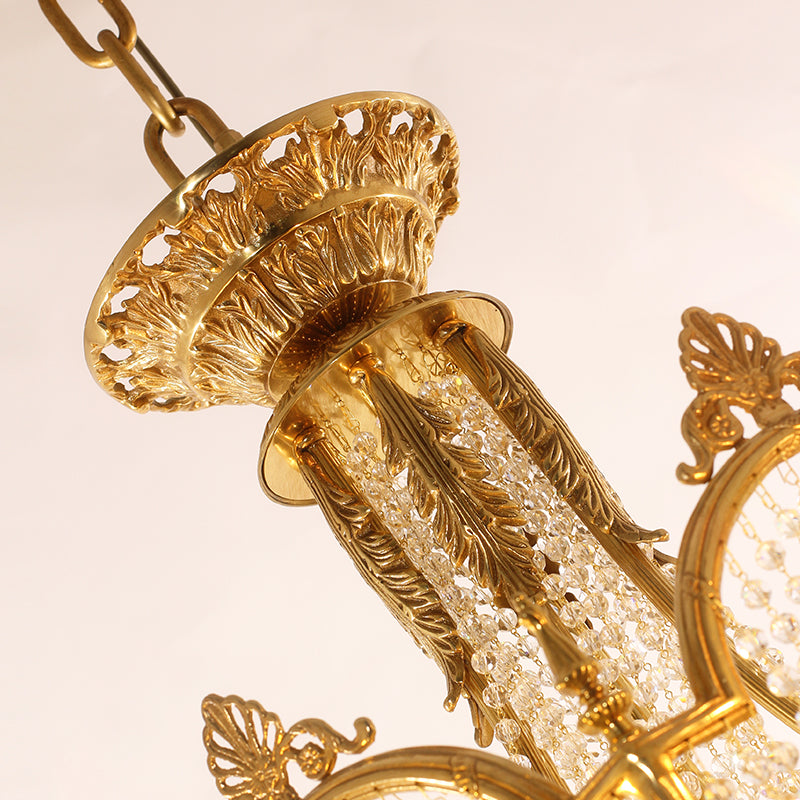Extreme detail shot focusing on the candle drips, the crystal finial, and the pierced brass canopy at the top.