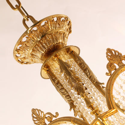 Extreme detail shot focusing on the candle drips, the crystal finial, and the pierced brass canopy at the top.
