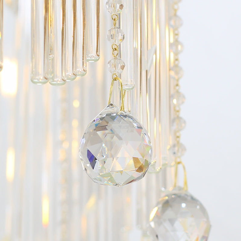 Macro close-up of the finely detailed golden acanthus leaf accents and the precision-cut crystal prisms.