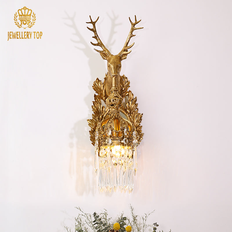 The home decorative wall light mounted beside green plants, adding a touch of natural sophistication.